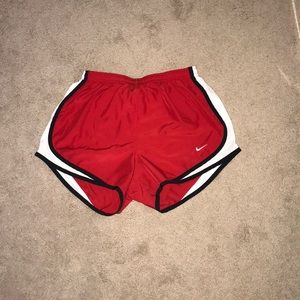 Red Nike running shorts